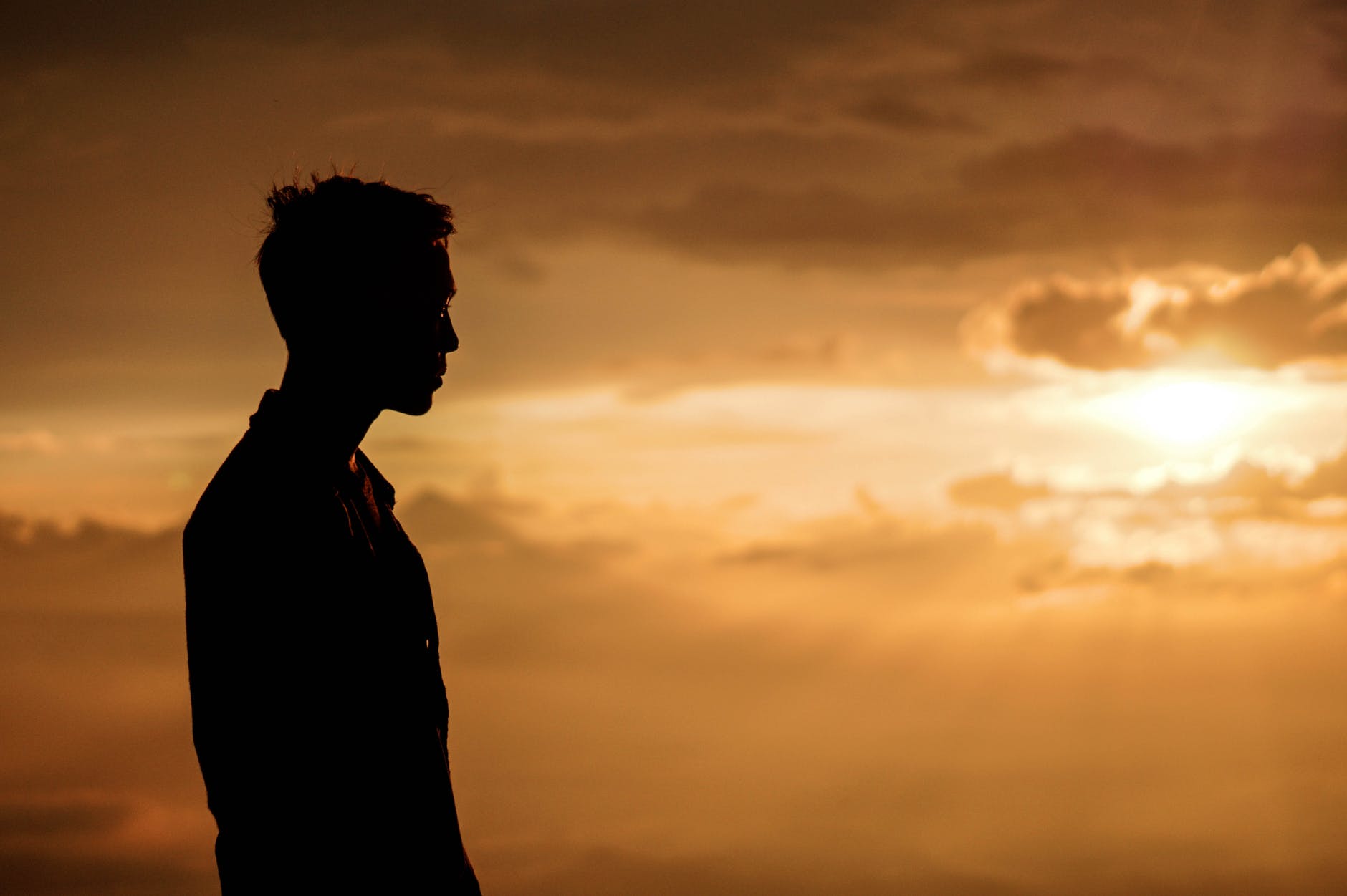 silhouette of man at sunset