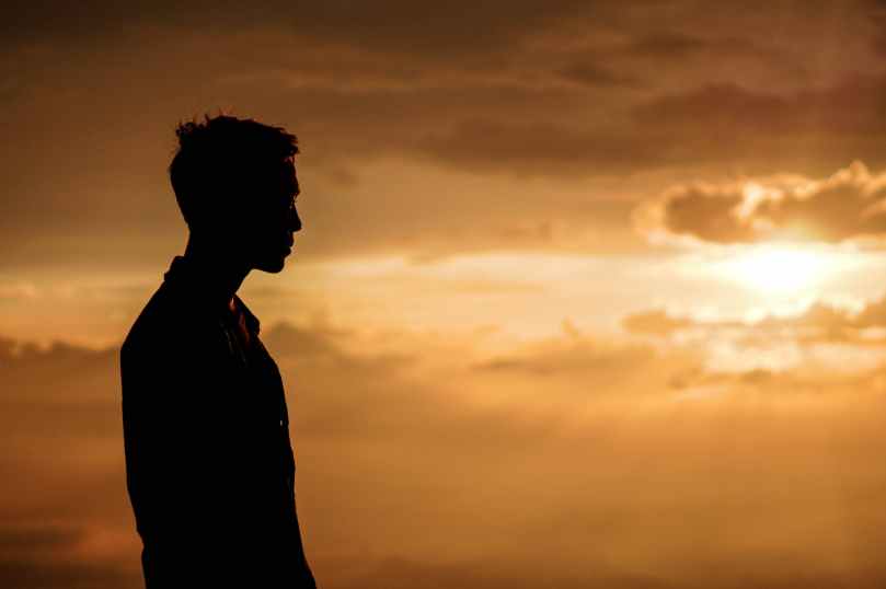 silhouette of man at sunset
