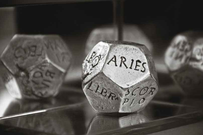 aries dice in gray scale photography